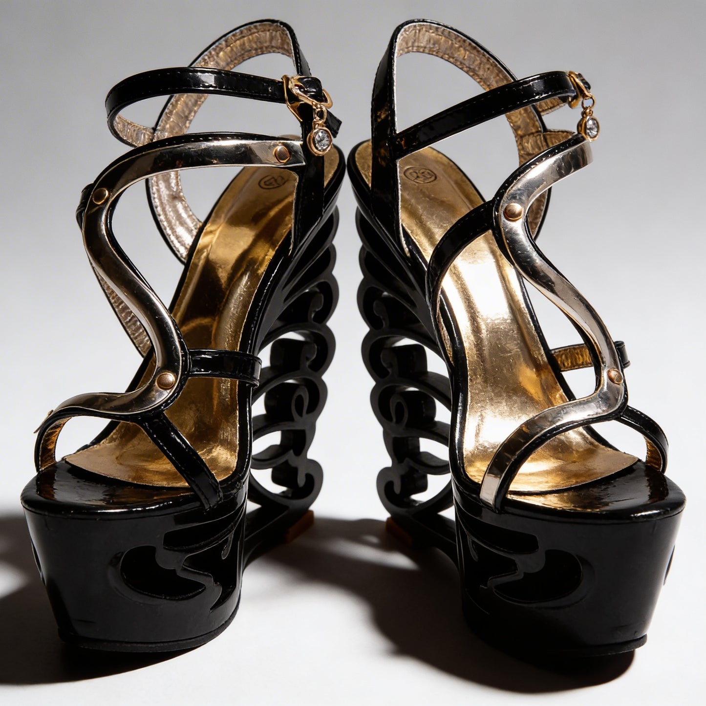 Orfeo Sculptural Wedge Sandals Collection